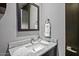 Well-lit bathroom vanity with granite countertop, modern fixtures, and elegant decor at 39810 N 105Th Way # 128, Scottsdale, AZ 85262