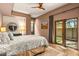 Calming bedroom with soft lighting, access to the outside, and a comfortable bed in neutral tones at 39810 N 105Th Way # 128, Scottsdale, AZ 85262