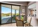 Indoor/outdoor dining area with views of the pool, outdoor living space, and desert landscaping at 39810 N 105Th Way # 128, Scottsdale, AZ 85262