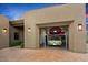 Three-car garage equipped with a car lift at 39810 N 105Th Way # 128, Scottsdale, AZ 85262