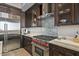 Close up of a modern kitchen with stainless steel appliances and light countertops at 39810 N 105Th Way # 128, Scottsdale, AZ 85262
