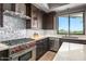 Bright kitchen with stainless steel appliances, stylish backsplash, and views of the surrounding area at 39810 N 105Th Way # 128, Scottsdale, AZ 85262