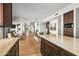 Open kitchen with large island, granite countertops, stainless steel appliances, and custom cabinetry at 39810 N 105Th Way # 128, Scottsdale, AZ 85262