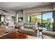 Open concept living area with desert views through sliding glass doors at 39810 N 105Th Way # 128, Scottsdale, AZ 85262