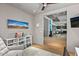 Comfortable office space with neutral tones, ceiling fan, comfortable chair, and ample natural light at 39810 N 105Th Way # 128, Scottsdale, AZ 85262
