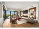 Stylish living room with fireplace, desert views, and ample seating at 39810 N 105Th Way # 128, Scottsdale, AZ 85262