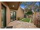 Back patio area with a view into the bedroom and a small yard at 39810 N 105Th Way # 128, Scottsdale, AZ 85262