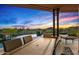 Outdoor dining area on the patio with comfortable seating and desert views at 39810 N 105Th Way # 128, Scottsdale, AZ 85262