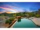 Stunning pool area with desert landscaping and mountain views at sunset at 39810 N 105Th Way # 128, Scottsdale, AZ 85262