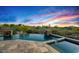 Inviting pool featuring lush desert landscaping and serene mountain views at sunset at 39810 N 105Th Way # 128, Scottsdale, AZ 85262