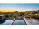 Relaxing pool and spa area with a cozy fire feature and desert landscape at 39810 N 105Th Way # 128, Scottsdale, AZ 85262