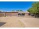 Back of a home with an unpaved backyard and lots of natural light at 4349 W Morten Ave, Glendale, AZ 85301