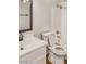 Clean bathroom with a vanity, sink, toilet, and shower-tub combination, providing essential amenities at 4349 W Morten Ave, Glendale, AZ 85301