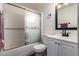 Neutral bathroom includes tub/shower combination and a black framed mirror at 4349 W Morten Ave, Glendale, AZ 85301