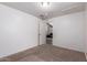 Neutral bedroom with carpet, natural light and an open doorway at 4349 W Morten Ave, Glendale, AZ 85301