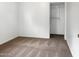 Cozy bedroom featuring a standard closet and neutral colored carpet at 4349 W Morten Ave, Glendale, AZ 85301