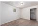 A bright bedroom with neutral carpet, a window and closet space at 4349 W Morten Ave, Glendale, AZ 85301