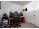 This bedroom features a desk, computer and gaming chair at 4349 W Morten Ave, Glendale, AZ 85301