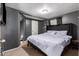 Bedroom offers neutral carpet, dark gray walls, walk-in closet and ceiling fan at 4349 W Morten Ave, Glendale, AZ 85301