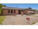 Charming brick home featuring a covered carport and inviting front entrance at 4349 W Morten Ave, Glendale, AZ 85301