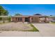 Lovely single-story home with brick accents, covered carport, and neat front lawn at 4349 W Morten Ave, Glendale, AZ 85301