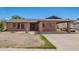 Inviting single-story home featuring brick accents and a convenient covered carport at 4349 W Morten Ave, Glendale, AZ 85301