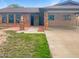 Charming home with a brick and grass-filled front yard at 4349 W Morten Ave, Glendale, AZ 85301