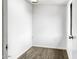 Hallway with wood-look vinyl floors and white walls at 4349 W Morten Ave, Glendale, AZ 85301