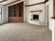 Spacious living room features a cozy fireplace and custom built-in shelving at 4349 W Morten Ave, Glendale, AZ 85301