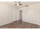 Spacious bedroom with hardwood floors, white walls, and large closet space at 4542 N 86Th Dr, Phoenix, AZ 85037