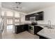 Updated kitchen boasting granite countertops, stainless steel appliances, and dark cabinets at 4542 N 86Th Dr, Phoenix, AZ 85037