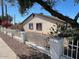 Charming single-story home with a well-maintained front yard and quaint fence at 4716 S Fair Nw Ln, Tempe, AZ 85282