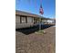 This home features low-maintenance desert landscaping, a carport, and an American flag at 4716 S Fair Nw Ln, Tempe, AZ 85282