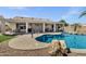 Inviting backyard pool surrounded by rocks, perfect for relaxation and outdoor entertainment at 5046 W Monte Cristo Ave, Glendale, AZ 85306