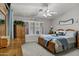 Inviting bedroom with plantation shutters, side tables and wood-framed bed at 5046 W Monte Cristo Ave, Glendale, AZ 85306