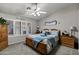 Inviting bedroom with plantation shutters, side tables and wood-framed bed at 5046 W Monte Cristo Ave, Glendale, AZ 85306