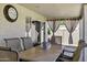 Inviting covered patio featuring a dining table and stylish curtains for relaxed outdoor dining at 5046 W Monte Cristo Ave, Glendale, AZ 85306