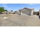 Single Gathering home featuring a large front yard, tile roof, block wall, and two car garage at 5046 W Monte Cristo Ave, Glendale, AZ 85306
