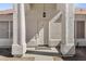 Elegant front door with decorative columns and hanging lantern, creating a welcoming entrance at 5046 W Monte Cristo Ave, Glendale, AZ 85306