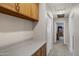 Functional hallway area with ample cabinet space and storage options at 5046 W Monte Cristo Ave, Glendale, AZ 85306