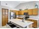 Spacious kitchen boasts stainless steel appliances, an island, and ample cabinet space at 5046 W Monte Cristo Ave, Glendale, AZ 85306