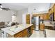 Open-concept kitchen with stainless steel fridge and center island with wine storage at 5046 W Monte Cristo Ave, Glendale, AZ 85306