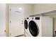 Well-equipped laundry area featuring a large washer and dryer for convenience at 5046 W Monte Cristo Ave, Glendale, AZ 85306
