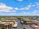 An aerial view capturing the layout of an apartment complex with parking, landscaping, and residential buildings at 537 S Delaware Dr # 224, Apache Junction, AZ 85120