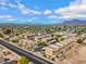 An aerial view of a well-maintained apartment complex with covered parking and lush landscaping under a bright sky at 537 S Delaware Dr # 224, Apache Junction, AZ 85120