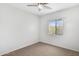Bedroom with neutral carpet, a ceiling fan, and window at 537 S Delaware Dr # 224, Apache Junction, AZ 85120