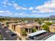 View of an apartment complex featuring covered parking and mature trees, creating a welcoming community atmosphere at 537 S Delaware Dr # 224, Apache Junction, AZ 85120