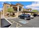 Inviting exterior of a condo featuring assigned covered parking and convenient disability parking space at 537 S Delaware Dr # 224, Apache Junction, AZ 85120
