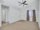 Bright living room with neutral carpet, ceiling fan, and front door at 537 S Delaware Dr # 224, Apache Junction, AZ 85120