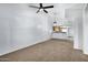 Spacious living room with modern ceiling fan and easy access to the kitchen at 537 S Delaware Dr # 224, Apache Junction, AZ 85120